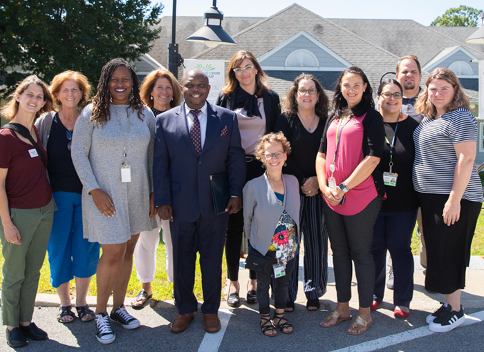 TLC Staff with MCDHH Commissioner Ope